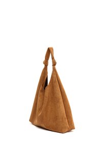 Suede shoulder bag in a warm brown color, featuring an oversized, slouchy design with knotted handles and a soft texture.