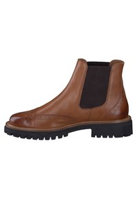 Bottines Chelsea en cuir marron avec un empiècement élastique noir sur le côté, des détails brogues et une semelle noire épaisse à rainures.