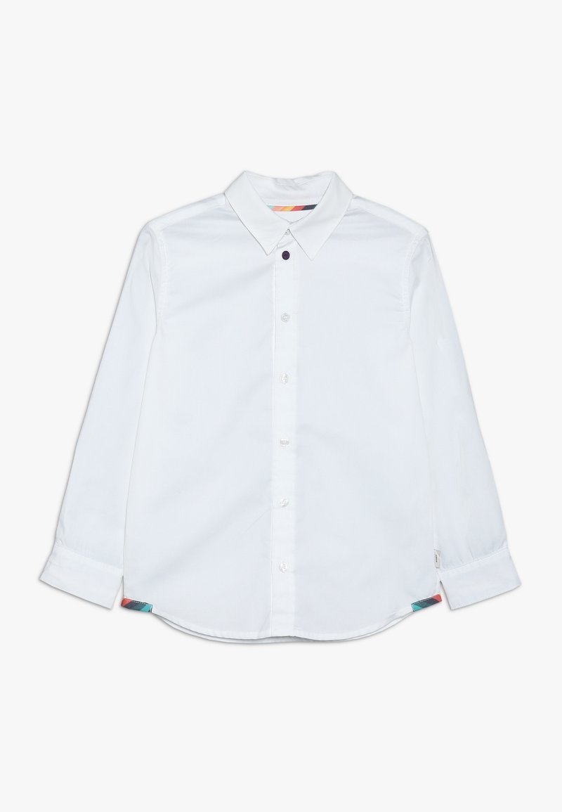 Valkoinen pitkähihainen paita, jossa on nappikaulus, pyöristetty helma ja värikkäät yksityiskohdat sivusaumoissa. Sujuva pinta, puuvillamateriaali.