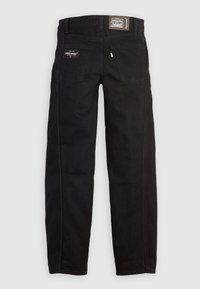 Black denim jeans with a straight leg design. Features back pockets and branding labels on the waistband and pocket. Smooth texture.