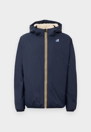 Navy blue puffer jacket with a zipper front, a lined hood, yellow and white accent stripes, and elastic cuffs. Features a logo on the chest.