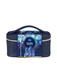 Navy blue cosmetic bag with a gold zipper, featuring a NIVEA product box on top displaying cream and body wash bottles. Handle included.