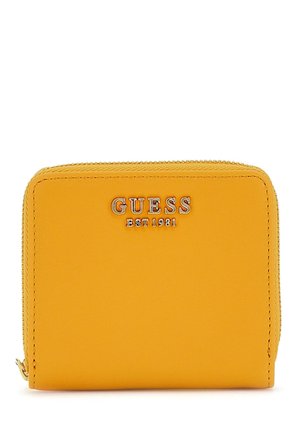 Yellow synthetic wallet featuring a zip closure, embossed "GUESS EST 1981" logo, smooth texture, and rectangular shape.