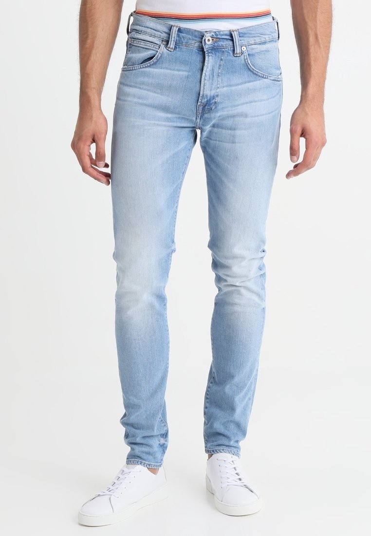 Ljust blå denimjeans i en slim fit-design, med subtil blekning, fem fickor och en klassisk bältesloop midja.