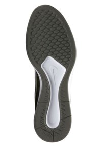 Nike-sko med en strukturerad svart yttersula och vit mellansula med en framträdande logotyp. Utmärkta greppmönster för bra fäste.