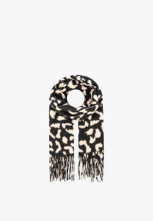 Schwarz-weißes Tierfellmuster-Tuch mit Fransenenden, in runder Form auf einem weißen Hintergrund gefaltet.