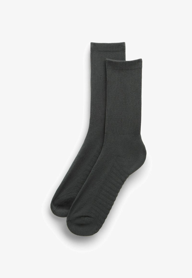 Paire de chaussettes montantes côtelées gris foncé avec talons et orteils renforcés, posées à plat sur un fond blanc.