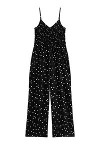 Tuta nera con pois bianchi, busto arricciato, spalline sottili e design a gamba larga. Presenta una cintura regolabile.
