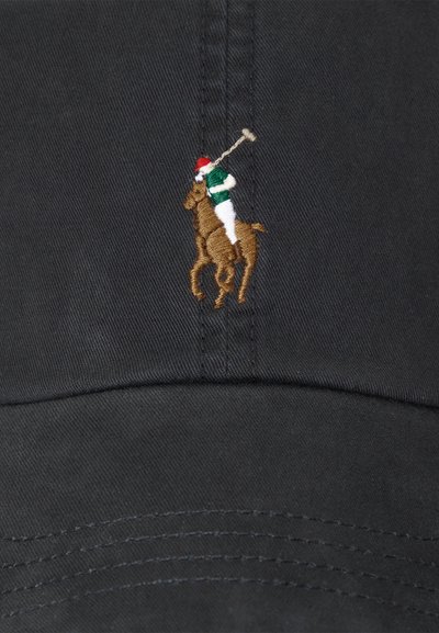 Black baseball cap featuring an embroidered gold and green polo player logo, with a red hat, textured fabric, and stitched brim.