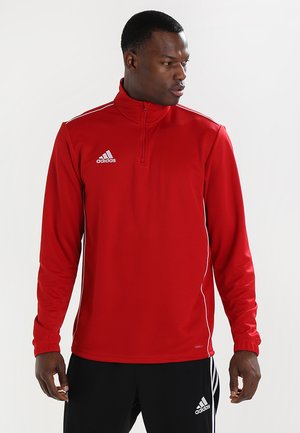 Maglione sportivo rosso con colletto a zip a un quarto, maniche lunghe e dettagli bianchi. Presenta il logo Adidas sul petto. Materiale in poliestere liscio.