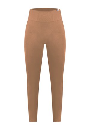 Ruske legice vyrobené z elastického materiálu, s vysokým pásom a hladkou textúrou. Bez viditeľných vzorov alebo kovových detailov.