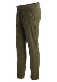 Olive green linen pants with a relaxed fit, featuring an elastic waistband, drawstring, and side pockets, rolled cuffs at the ankles.
