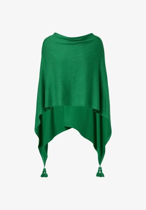 Poncho verde lavorato a maglia con orlo asimmetrico e frange negli angoli inferiori.