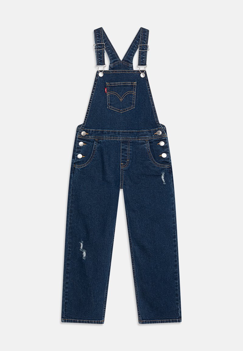 Salopette en jean bleu foncé avec bretelles ajustables, poche avant et boutons sur les côtés. Présente des détails déchirés sur les jambes.