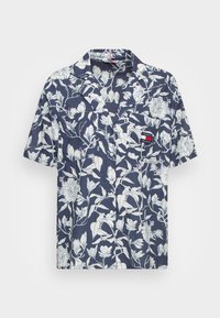 Camisa de manga corta en azul marino con estampado floral blanco; cuenta con un bolsillo en el pecho con etiqueta de logo, diseño de botones en la parte delantera y un corte relajado.