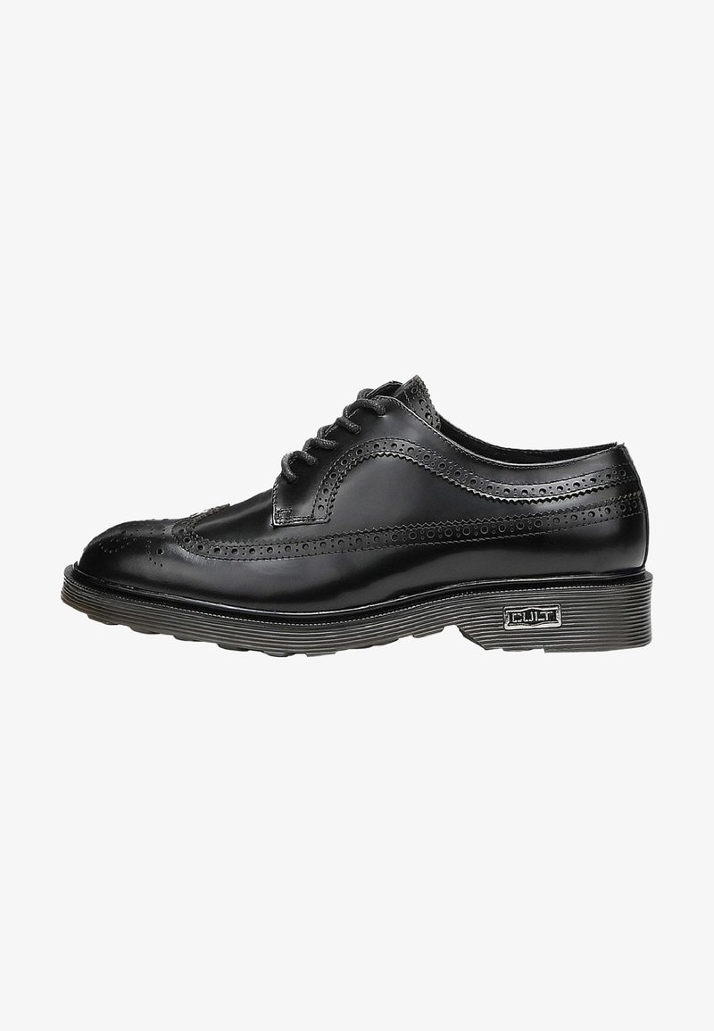 Scarpa brogue nera in pelle con perforazioni decorative, punta rotonda e suola in gomma grigia. Presenta sei occhielli e un accento con marchio sul lato.
