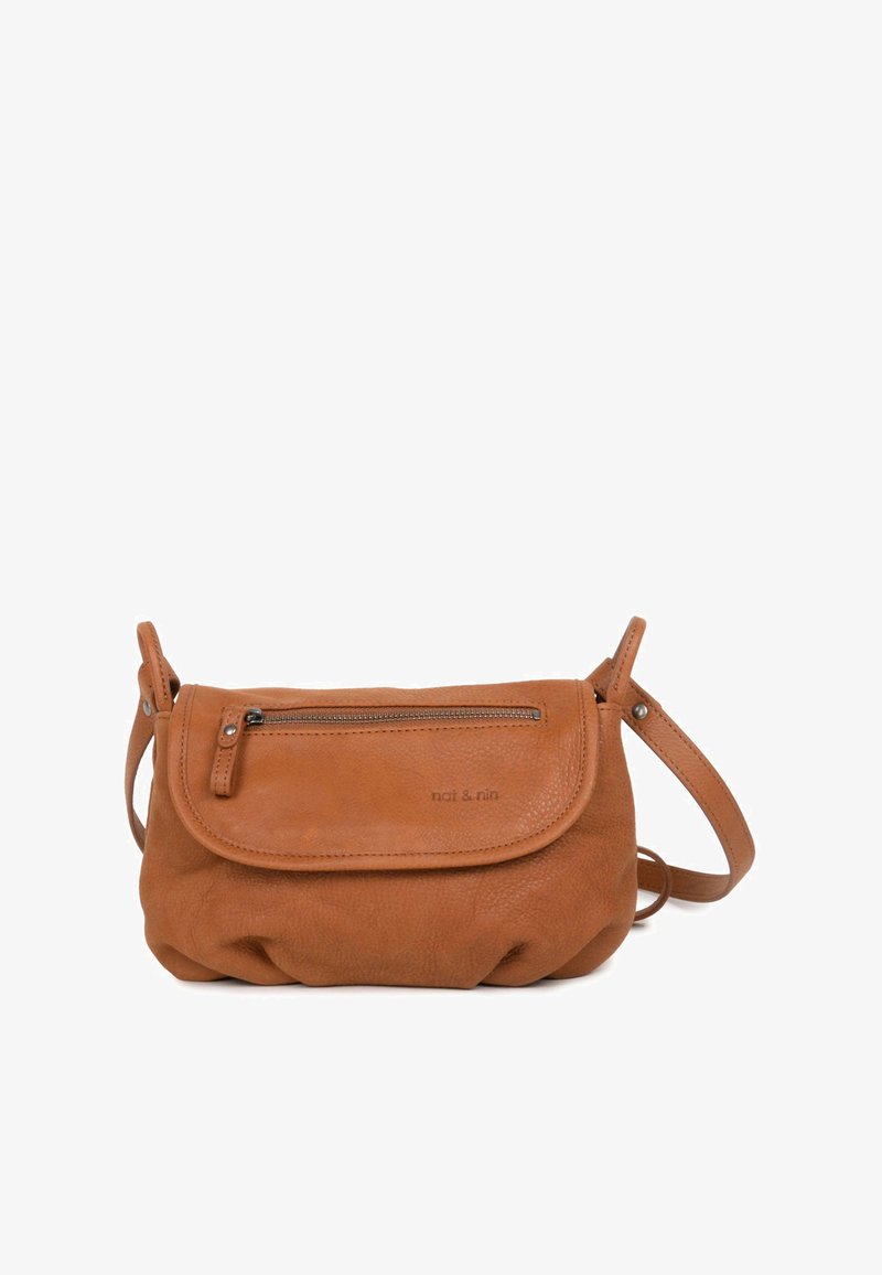 Brown leather crossbody bag with a rounded base, zipper pocket on the front, and a long adjustable strap. Subtle logo on the side.