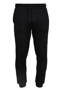 Pantalon de survêtement noir en tissu doux, avec jambes fuselées, taille élastique avec cordon de serrage et deux poches avant.