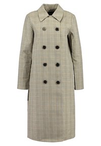 Double-breasted trench coat in a beige plaid pattern. Features black buttons, a wide collar, and long sleeves. Mid-length design.