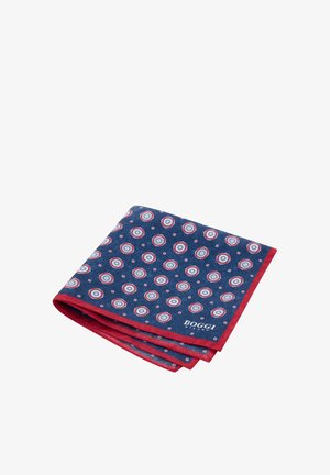 Pañuelo de bolsillo azul marino con borde rojo, que presenta círculos concéntricos en azul, blanco y rojo. Hecho de una tela suave con un diseño doblado.