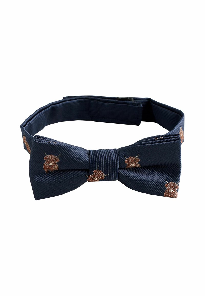 Tamsiai mėlynas peteliškė iš tekstūruotos medžiagos, puošta rudu gyvūnų siuvinėjimu. Ji turi klasikinę formą ir reguliuojamą dirželį pritaikymui.