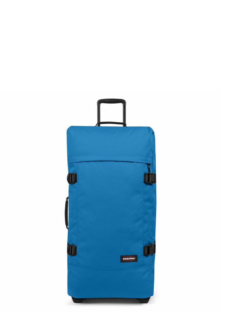Valigia a rotelle in tessuto blu brillante, forma rettangolare, dotata di manico retrattile, impugnatura laterale e dettagli in plastica nera.