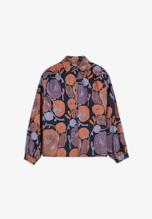 Button-up shirt in black cotton with large, irregular orange and purple abstract patterns. Features a classic collar and long sleeves.