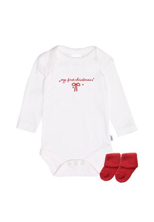 White long-sleeve onesie with red text "my first Christmas" and bow design. Accompanied by red fleece booties.