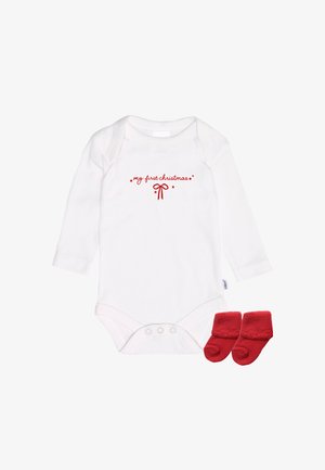 White long-sleeve onesie with red text "my first Christmas" and bow design. Accompanied by red fleece booties.