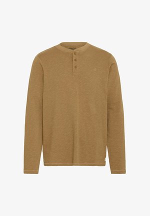 Long-sleeve, henley-style shirt in a light brown tone, featuring three buttons at the neckline and subtle texture. Logo on left chest.