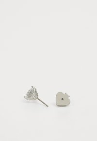 Silver earrings featuring a rose-shaped stud with a transparent gem and a heart-shaped flat backing. Both pieces have a polished finish.