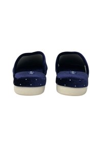 Pantofole slip-on blu navy con tessuto strutturato, pois bianchi e suola color crema. Design con parte posteriore aperta per una facile calzata.