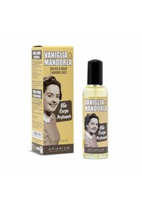 Olio di profumo in una bottiglia trasparente con un tappo nero. La scatola è beige con una foto vintage e testo in grassetto. Contiene vaniglia e mandorla.