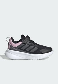 Black athletic shoes with a mesh upper, pink accents, a Velcro strap, and a white rubber sole featuring textured details.