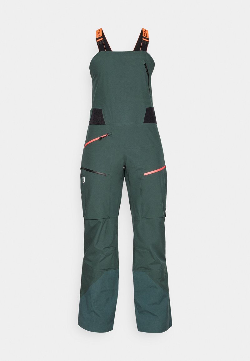 Grüner wasserdichter Overall mit verstellbaren orangefarbigen Trägern, Reißverschlusstaschen, strukturiertem Stoff und tailliertem Design.