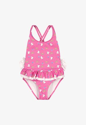 Bañador rosa para niña pequeña con patrones de unicornio, arcoíris y palmeras, con tirantes cruzados en los hombros y falda con volantes con lazos blancos a los lados.