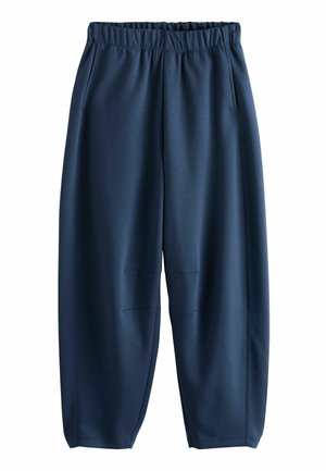 Navy blue athletic pants made of lightweight fabric, featuring an elastic waistband, side pockets, and a tapered leg design with minimal stitching.