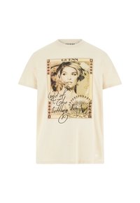 Camiseta de algodón crema con un estampado gráfico del retrato de una mujer y el texto "Tierra del Sol Servidor", con detalles decorativos en el borde.