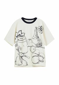 Cream T-shirt features black line drawings of a teapot, fruits, and flowers. It has a contrasting navy round neckline and short sleeves.
