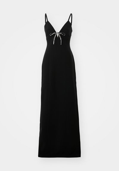 Black evening dress with a V-neckline, thin straps, and a rhinestone-accented bow at the waist. Long, fitted silhouette with smooth fabric.