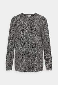 Blusa preta de mangas longas com um padrão salpicado branco, apresentando um decote redondo e uma ligeira frunçe na cintura para um ajuste descontraído.
