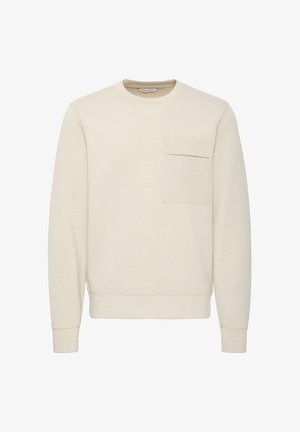 Beige crew neck sweatshirt made of soft fabric, featuring a chest pocket, ribbed cuffs, and hem. Smooth texture with minimal design elements.