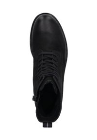 Bottine noire en cuir et daim, dotée de lacets, d'une fermeture éclair sur le côté et d'un bout arrondi. Texture lisse avec une semelle plate.