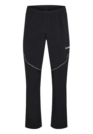 Czarne spodnie sportowe z elastycznym pasem, białymi, zakrzywionymi odblaskowymi detalami na udach i małym logo „hummel” na górnej części prawej nogawki.