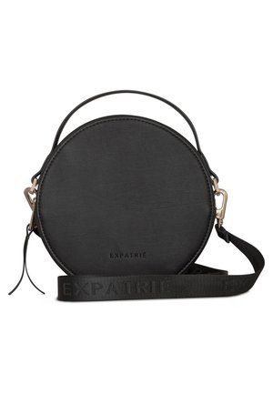 Black round leather handbag with short handle, detachable branded shoulder strap, and gold-tone hardware clips.