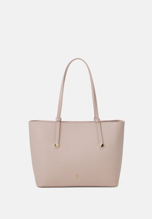 Light pink tote bag made of textured material, featuring two long handles and gold-tone square accents. Minimalist design, open top.