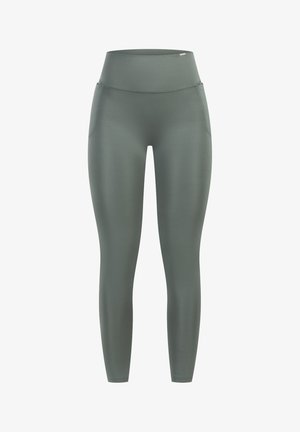 Leggings a vita alta, aderenti, di un verde tenue, realizzati in materiale liscio ed elastico con tasche laterali.