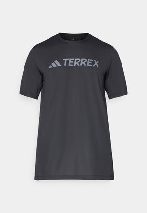 T-shirt noir à manches courtes en tissu léger, arborant un logo « TERREX » gris clair sur la poitrine et un col rond.
