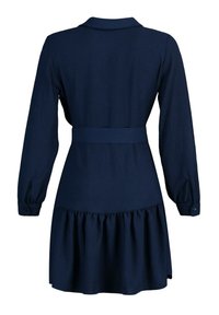 Robe manches longues bleu marine avec col, ceinture taille ajustée, poignets boutonnés et ourlet à volants froncés, vue de dos.