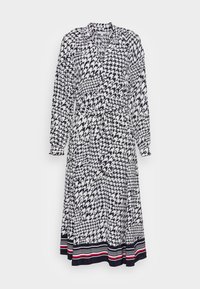 Lång, wrap-stil klänning i marinblå och vit hundtandsmönster. Har en krage, långa ärmar och ett knytbälte. Randig nederkant med röda och marinblå detaljer.